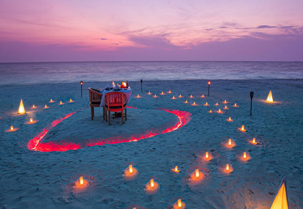 Candlelight beach dinner setup